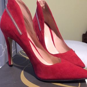 Beautiful red stilettos with zipper detail.